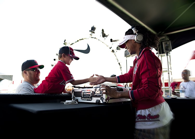 Corporate Event DJ Will Gill and family exchange high five at World Series