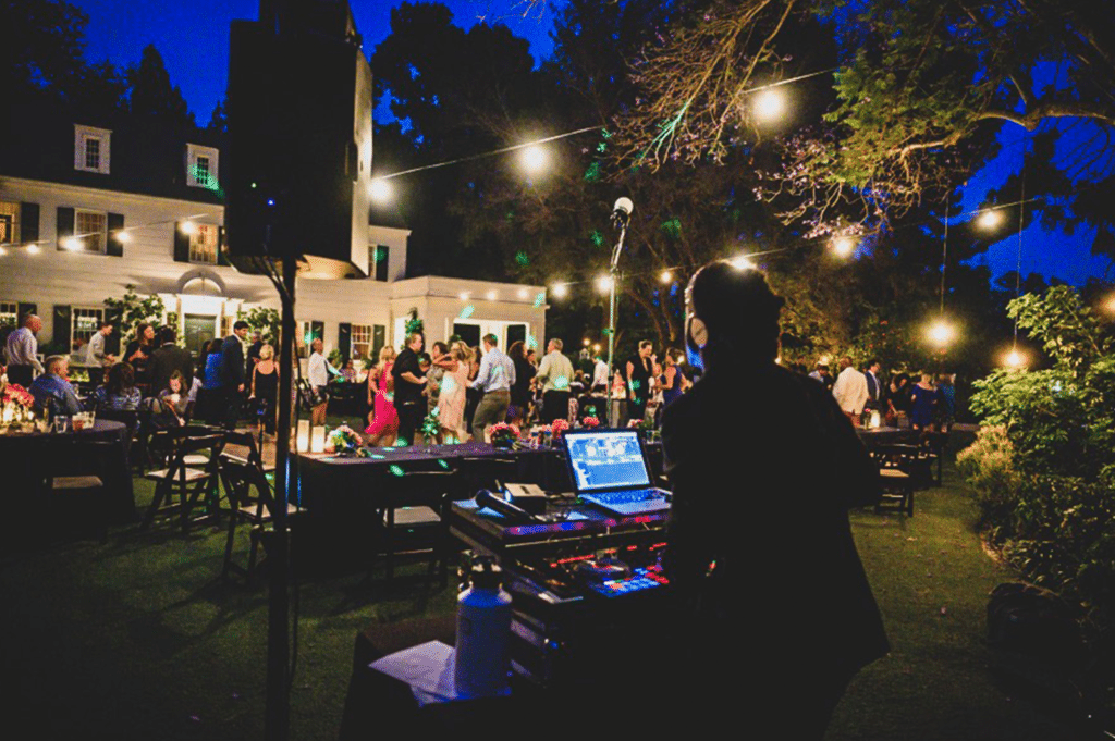 DJ WILL GILL PLAYING A MUSIC TO A PACKED DANCE FLOOR