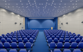 An event space with blue chairs for corporate events in Las Vegas