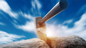 An axe chopping a rock into two