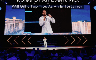 Event MC on stage with title caption reading Roles of An Event Mc
