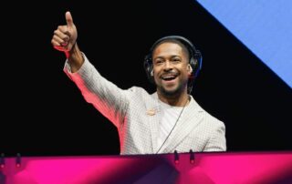Corporate emcee and DJ - Will Gill doing the thumbs up sign in one of his coprorate events in Las Vegas
