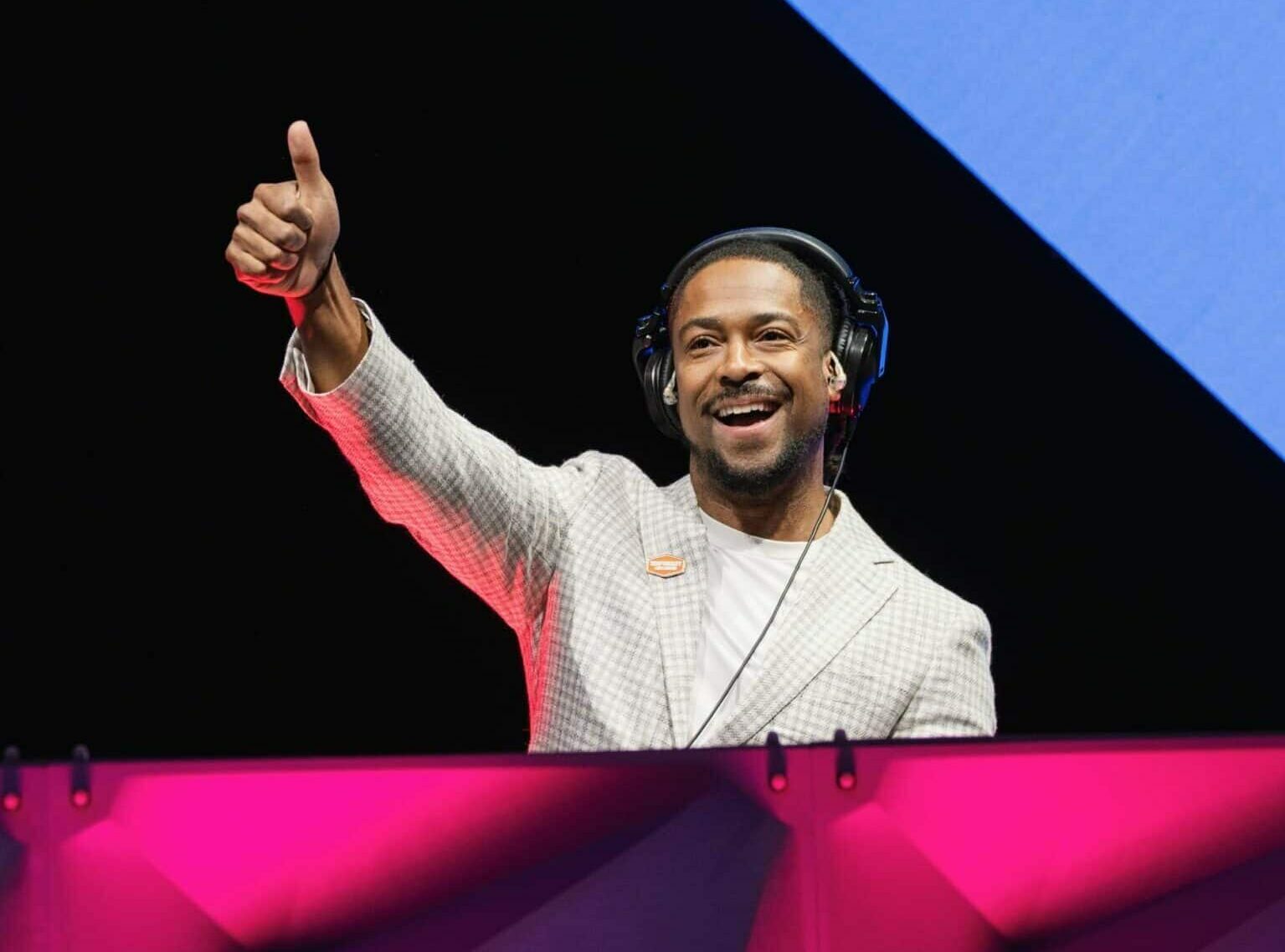 Corporate emcee and DJ - Will Gill doing the thumbs up sign in one of his corporate events in Las Vegas