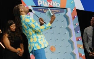 DJ Will Gill hosting a game show at a corporate event in Las Vegas