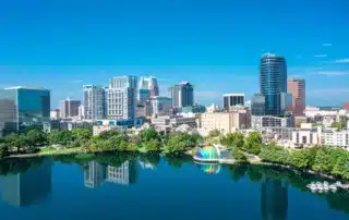 Downtown Orlando Florida lake and multiple buildings and trees
