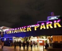 Front of Container Park Las Vegas full of people and neon lights