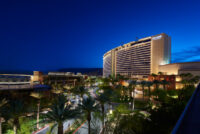 Red Rock Casino Resort & Spa Building full of palm trees in its front yard