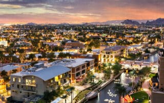 Scottsdale multiple buildings, lights and a river