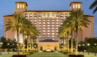 The Ritz-Carlton Orlando, Grande Lakes Front Building full of lights and palm trees