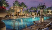 The Venetian Resort luxury pool with palm trees