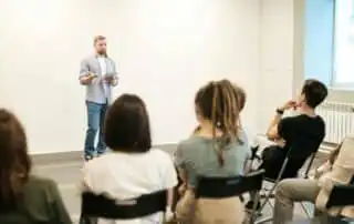 People on a Meeting Discussing on How to Personalize Sales Kickoff Content for Impact
