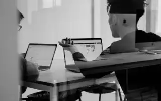 Two people talking about partnering with a Sales Kickoff Agency