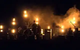 A corporate band performing on stage