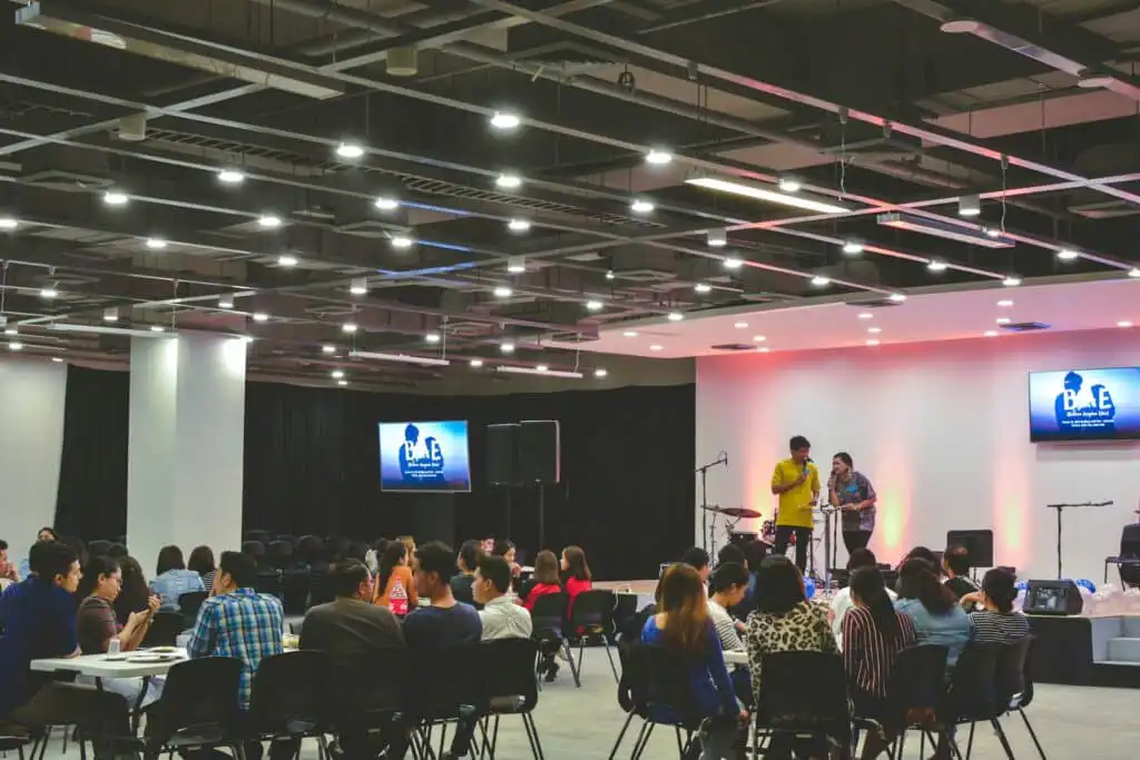 A professional corporate band performing live entertainment at a 2026 corporate event with full lineup and stage production