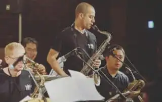 Four people member of corporate event band performing