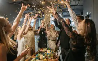 People celebrating the success of getting Corporate Gigs for Bands