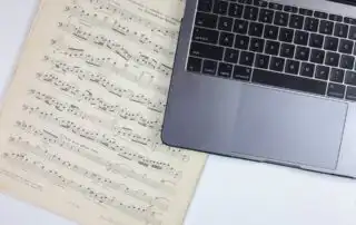 A laptop and music notes
