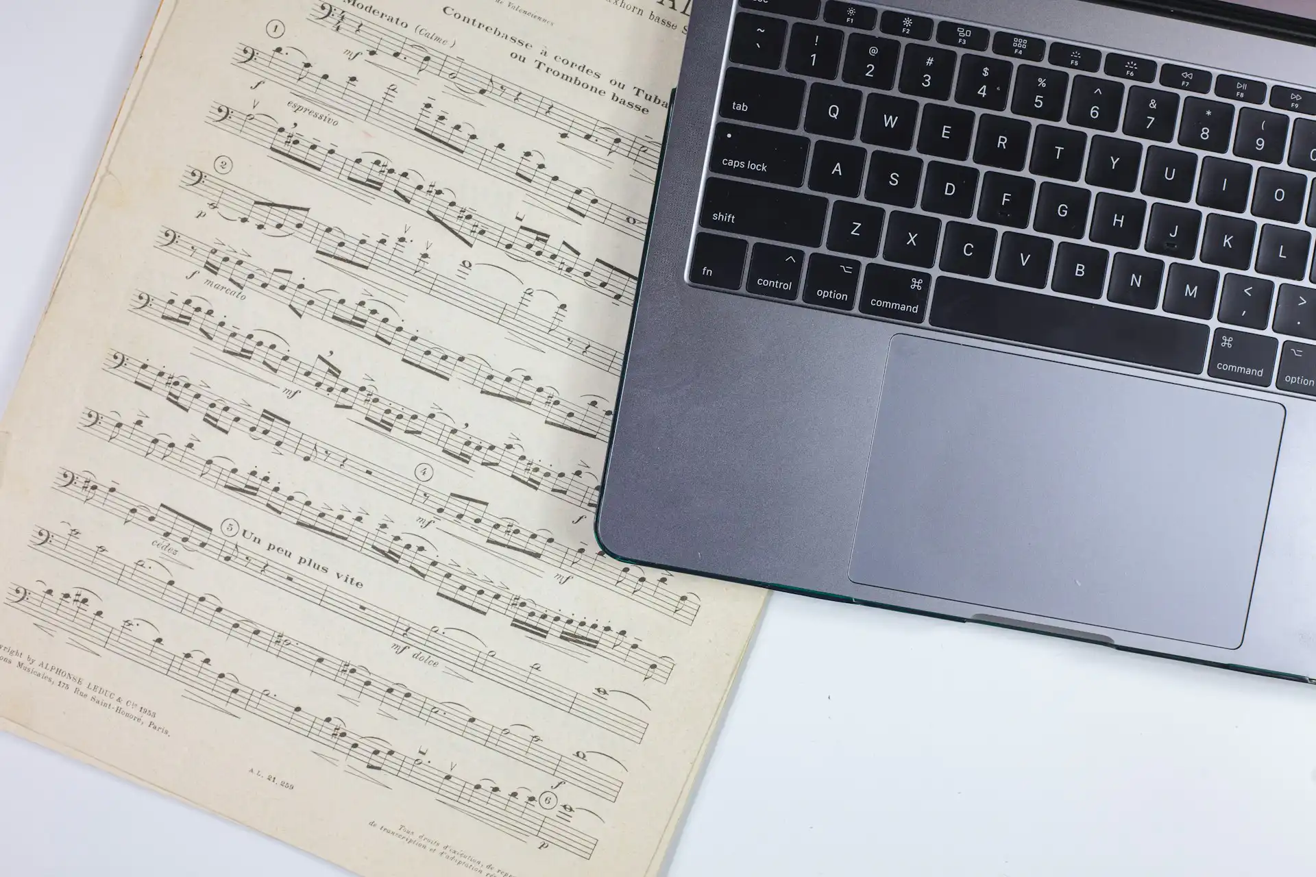 A laptop and music notes