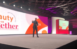 Marrakech Event MC Will Gill on stage pointing at crowd at The Ulta Beauty Corporate Conference