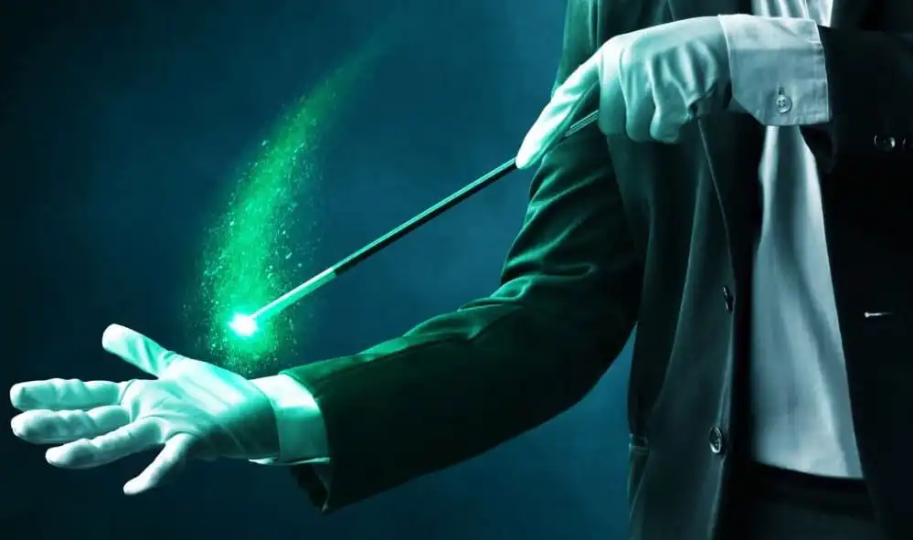 A mentalists in a formal suit and white gloves performing a trick with a glowing green magic wand, surrounded by sparkling green effects