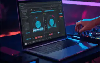 A DJ streaming music setup showing a laptop interface with playlists