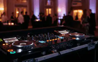 DJ booth with mixer playing corporate music