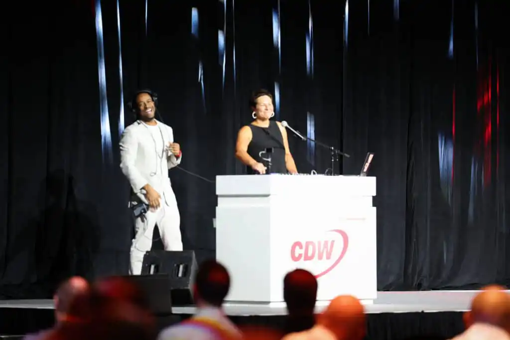 Miami Corporate Event DJ Will Gill onstage teaching CDW President Chris Leahy how to DJ
