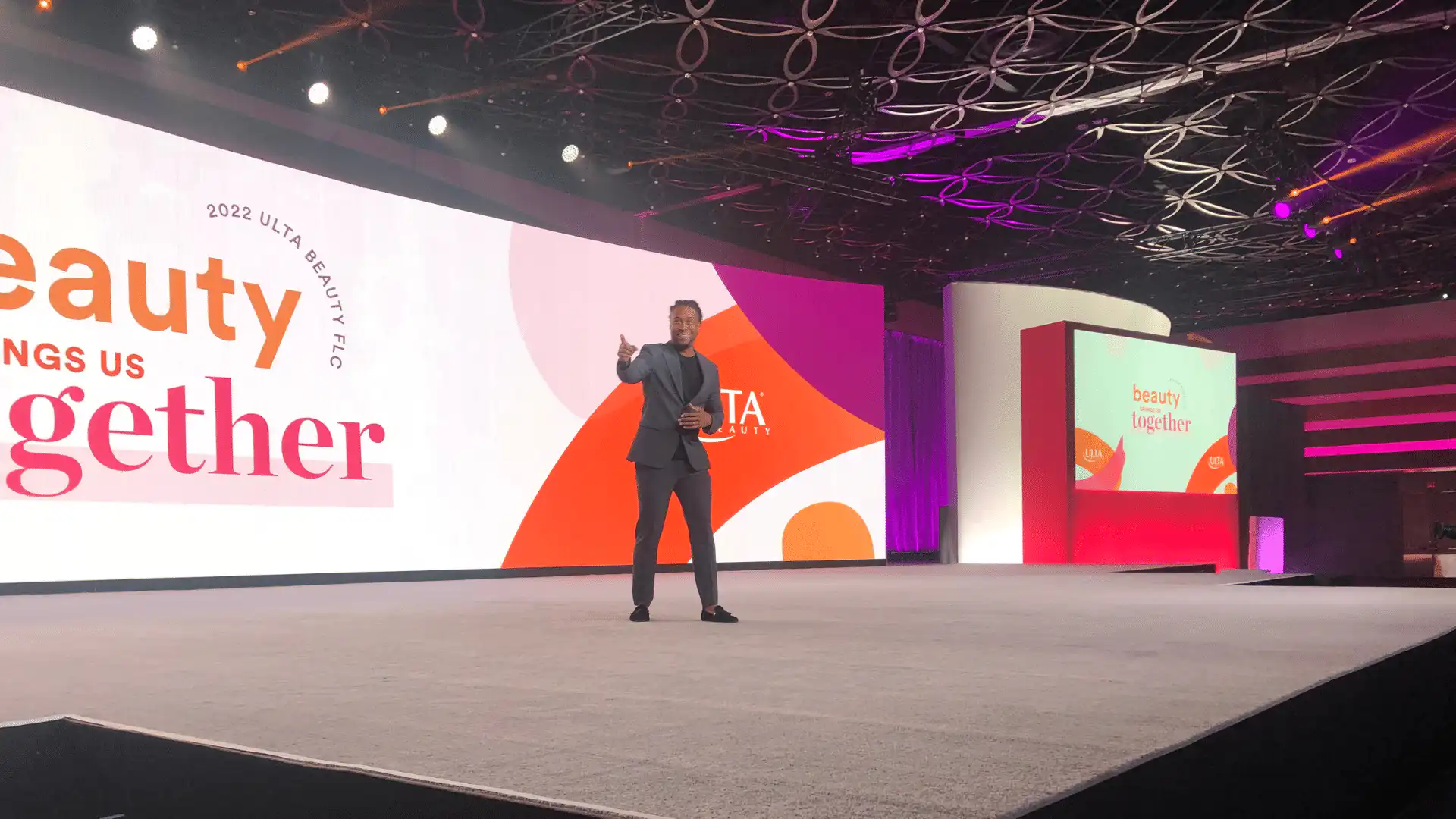 San Francisco Corporate Event DJ Will Gill on stage pointing at crowd at The Ulta Beauty Corporate Conference