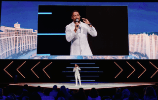 Las Vegas Corporate Event Emcee is onstage and on screen for Hilton Corporate Conference