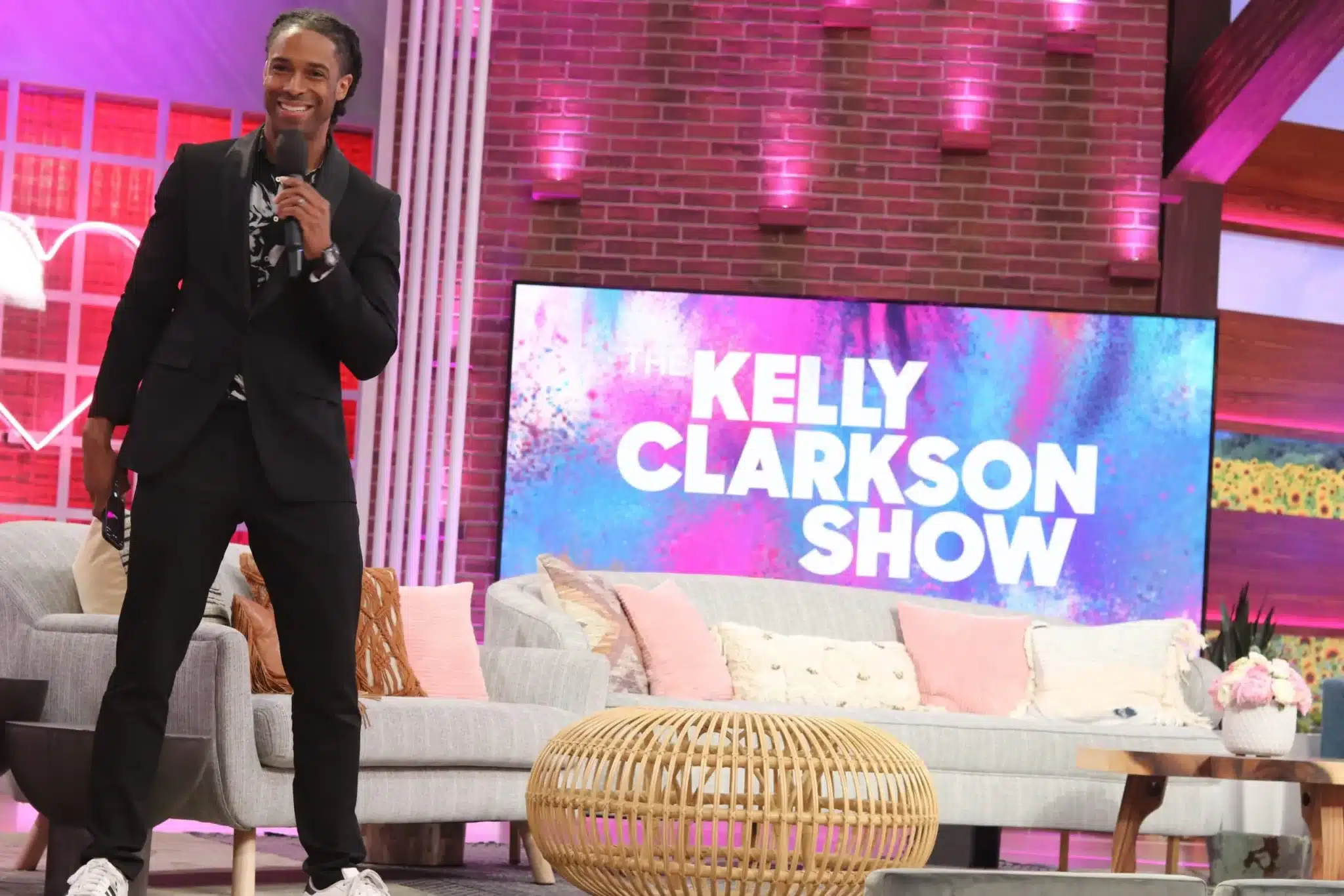 Corporate Emcee Will Gill facilitating audience interaction with engaged attendees in Kelly Clarkson Show