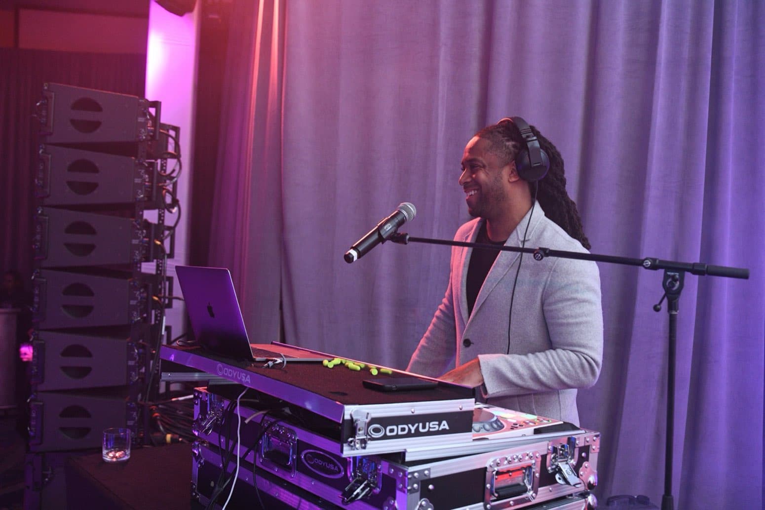 DJ Will Gill performing as a corporate event DJ behind the decks