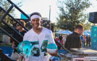 DJ Will Gill performing as a corporate DJ at an NFL Super Bowl event