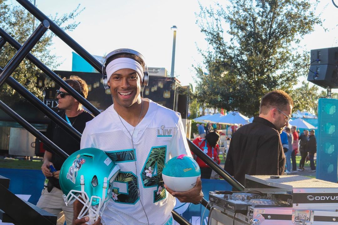 DJ Will Gill performing as a corporate DJ at an NFL Super Bowl event