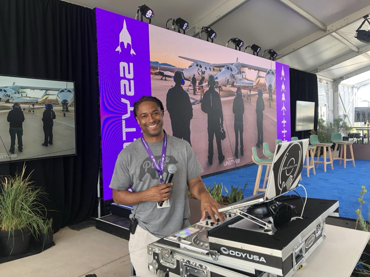 DJ Will Gill DJing and hosting at a corporate Unity event