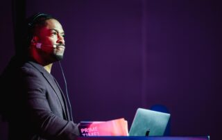 Corporate event DJ Will Gill mixing at a WalkMe event
