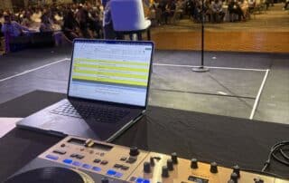 View from DJ Will Gill's booth over a full corporate ballroom at the JW Marriott Starr Pass in Tucson