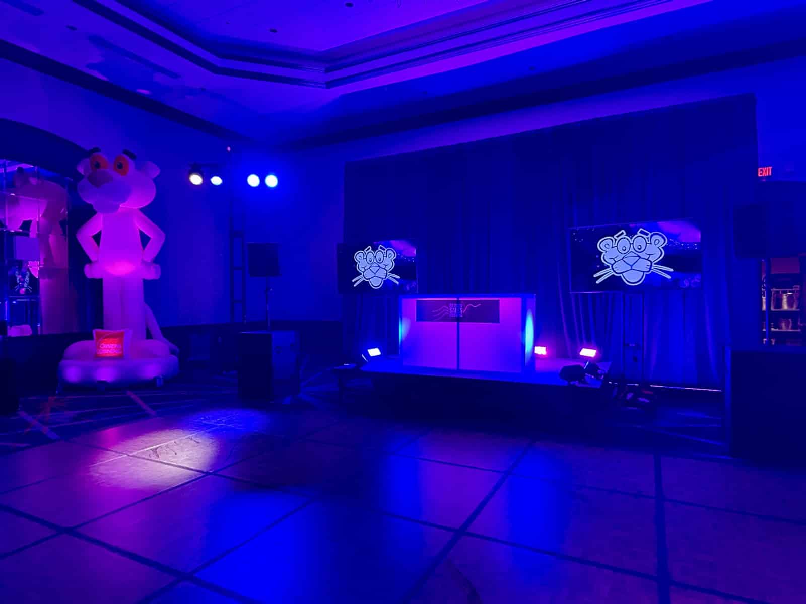 Corporate event stage and production setup for a full day DJ and emcee booking